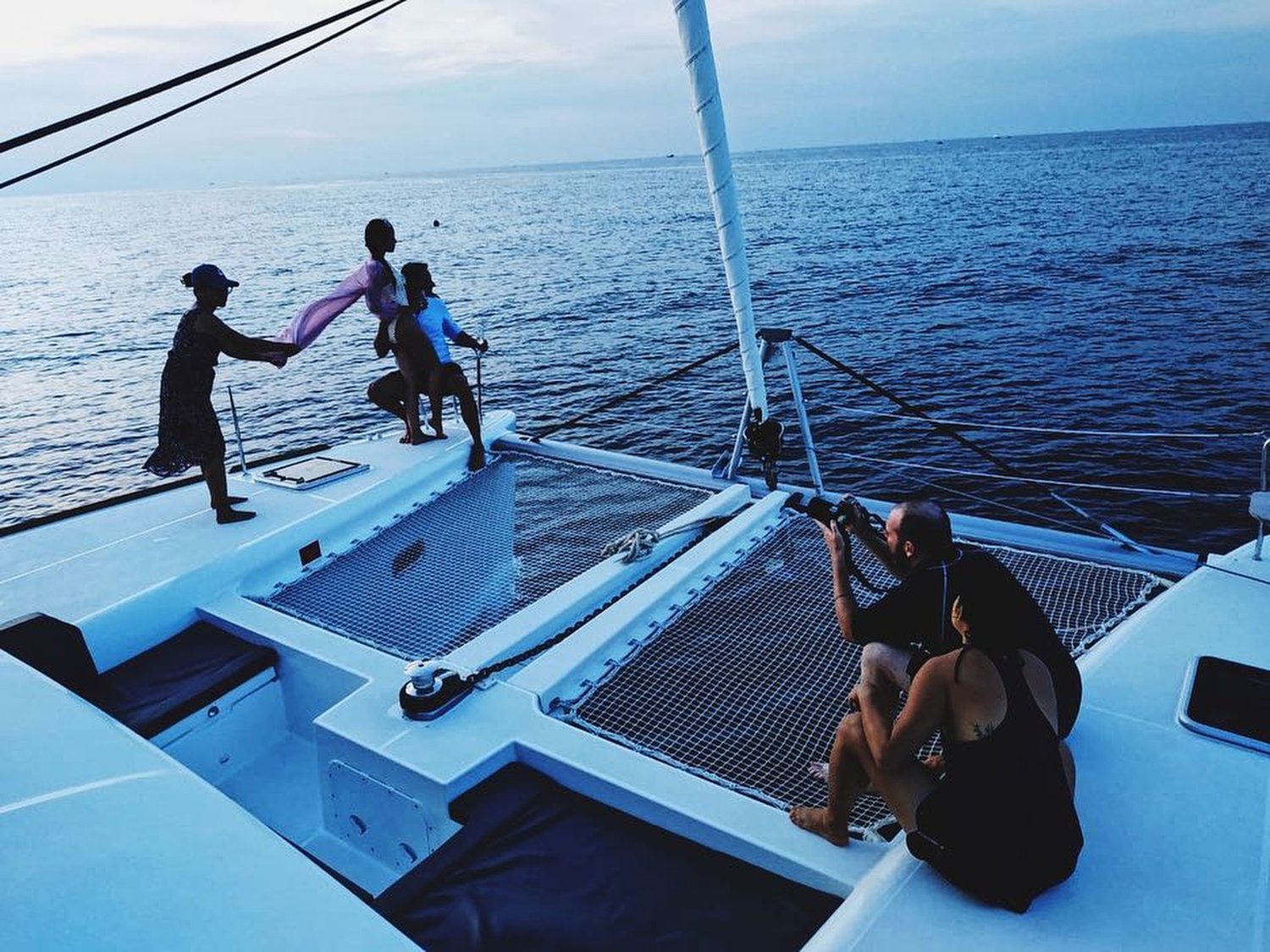 Mott Visuals crew directs a hotel lifestyle production on a sailing catamaran.